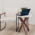 A laptop rests on a round table, running an automatic SEO audit